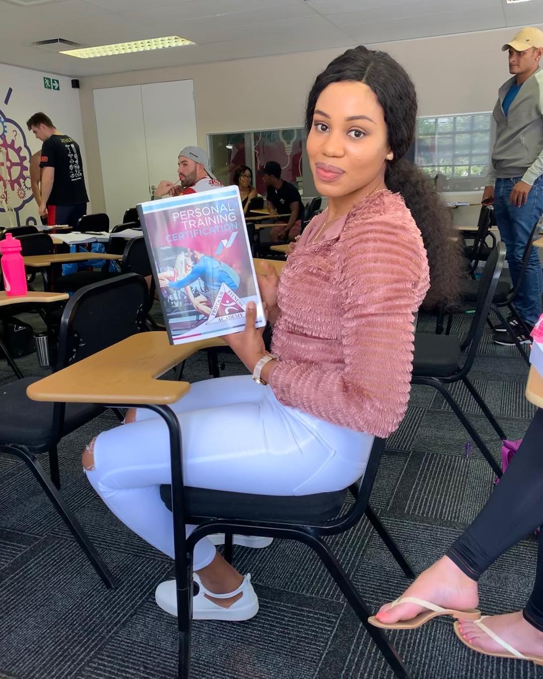 Sandra holding her Trifocus Personal Training Certification